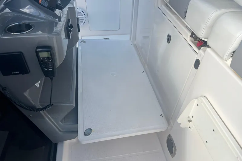 Slide: The Image of 2019 Pursuit S 368 Sport boat interior with seating and control panel. - 45