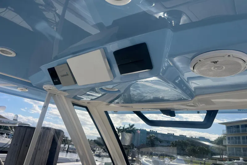 Slide: The Image of 2019 Pursuit S 368 Sport boat interior with Garmin electronics and speaker system. - 48