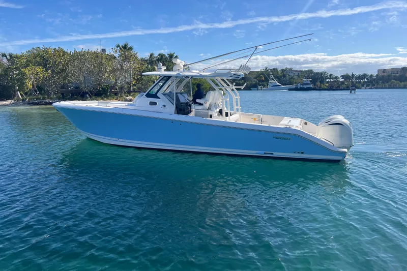 Slide: The Image of 2019 Pursuit S 368 Sport boat on clear blue water, sunny day. - 8