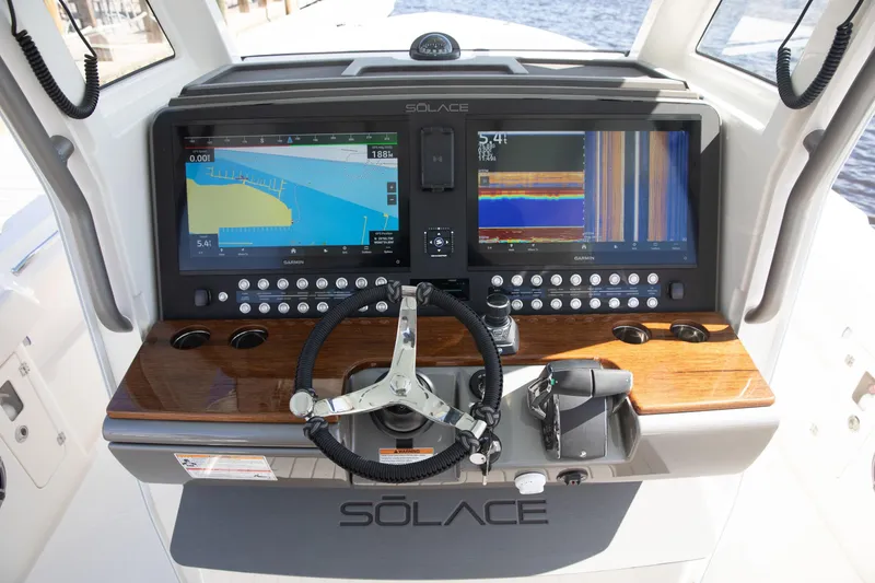 Slide: The Image of 2026 Solace 35 CS boat dashboard with advanced navigation displays and controls. - 5