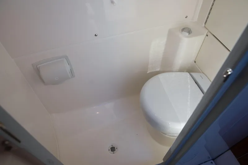Slide: The Image of Compact bathroom in 2026 Solace 35 CS boat, featuring a modern toilet and ventilation. - 8