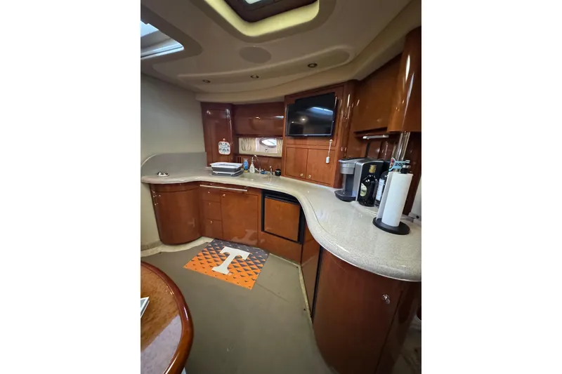 Slide: The Image of Luxurious 2003 Sea Ray 420 Sundancer yacht interior with modern kitchen amenities. - 2