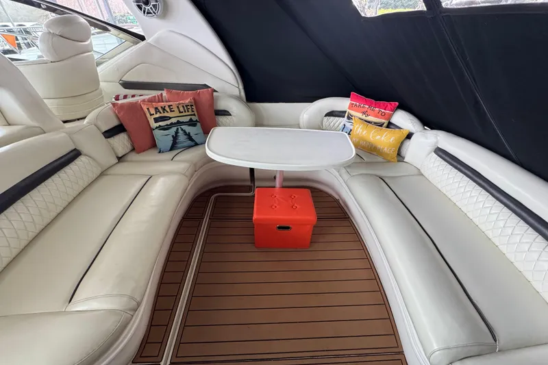 Slide: The Image of Luxurious 2003 Sea Ray 420 Sundancer interior with plush seating and decorative pillows. - 5