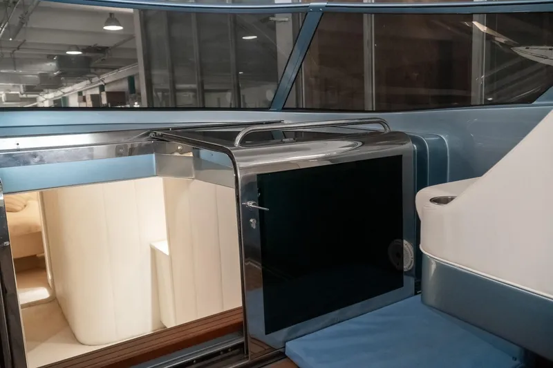 Slide: The Image of Interior of a 1997 Magnum 56 yacht, featuring sleek design and modern amenities. - 11