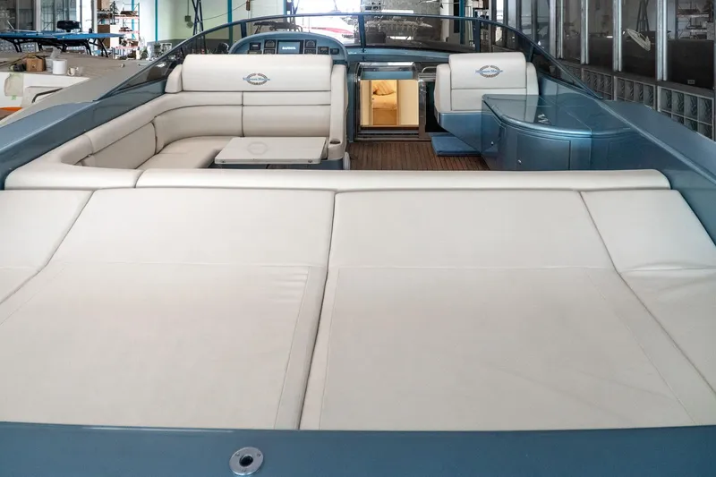 Slide: The Image of Luxurious 1997 Magnum 56 yacht interior with white seating and modern design. - 15