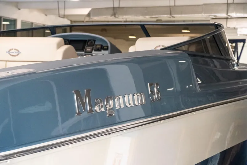 Slide: The Image of 1997 Magnum 56 boat interior with sleek design and luxury seating. - 19