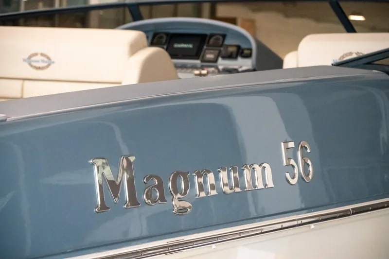 Slide: The Image of 1997 Magnum 56 boat interior with dashboard and seating. - 20