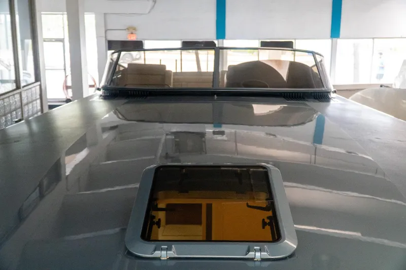 Slide: The Image of 1997 Magnum 56 yacht interior with sunroof, showcasing sleek design and luxury features. - 23