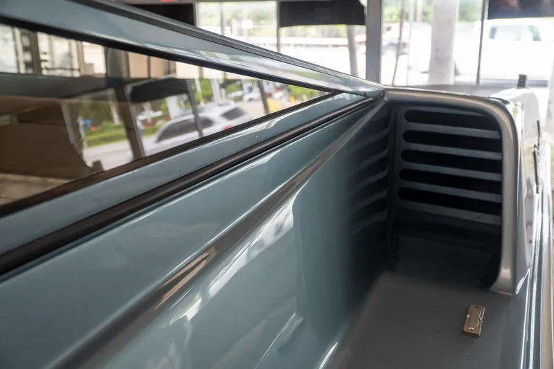 Slide: The Image of Close-up of a 1997 Magnum 56 truck bed interior, showcasing sleek design and metallic finish. - 27