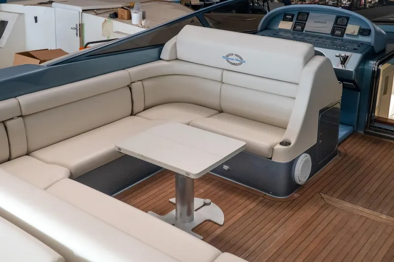 Slide: The Image of Luxurious seating area on a 1997 Magnum 56 yacht with wooden flooring. - 3