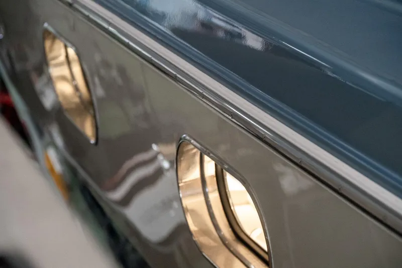 Slide: The Image of Close-up of 1997 Magnum 56 vehicle windows with reflective surface. - 37