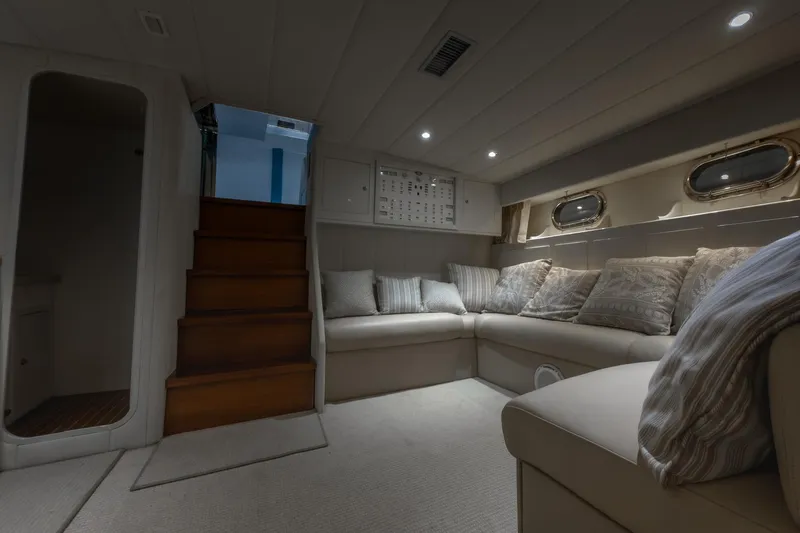 Slide: The Image of Luxurious interior of 1997 Magnum 56 yacht with cozy seating and elegant decor. - 44