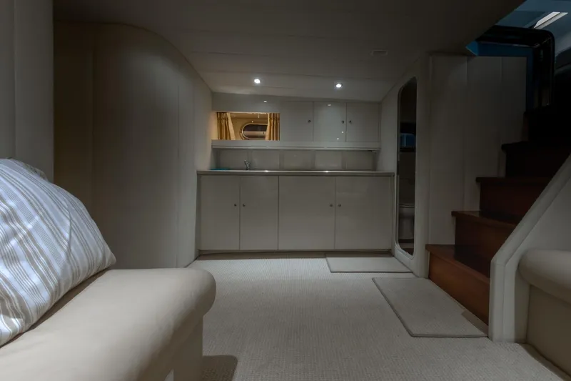 Slide: The Image of Luxurious interior of a 1997 Magnum 56 yacht with modern cabinetry and cozy seating. - 45