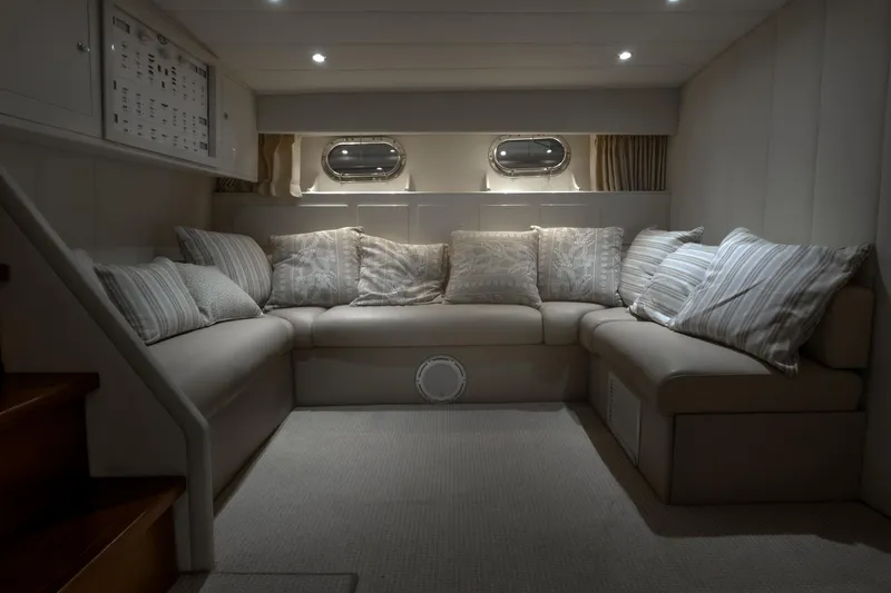 Slide: The Image of Luxurious interior of 1997 Magnum 56 yacht with cozy seating and ambient lighting. - 48