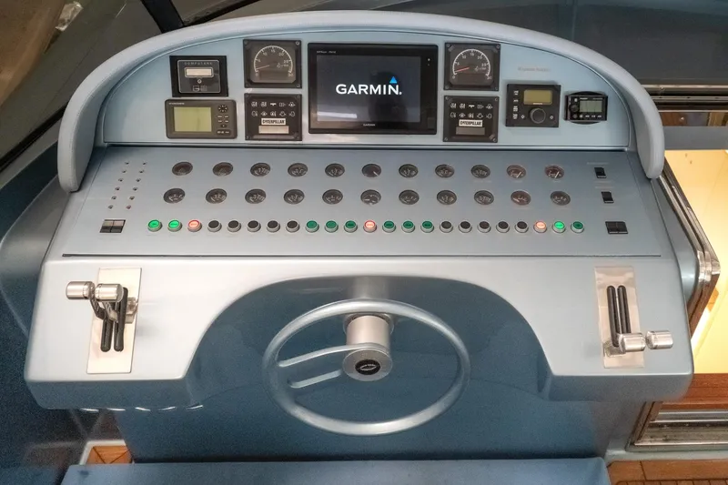 Slide: The Image of Control panel of a 1997 Magnum 56 yacht with Garmin navigation system. - 5