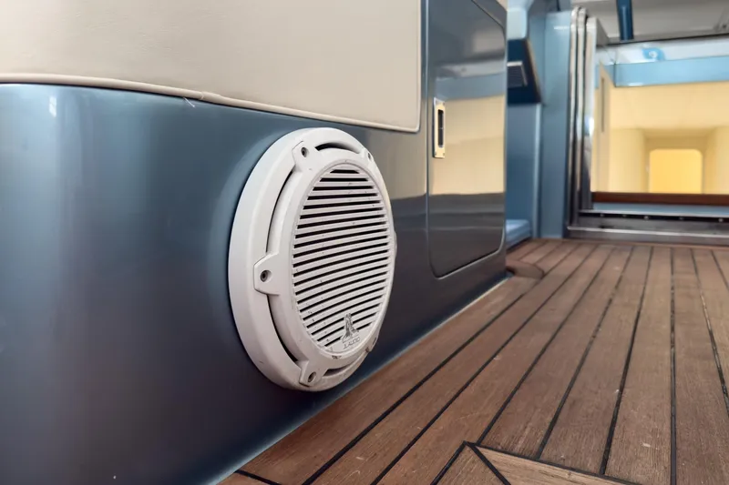 Slide: The Image of Interior of 1997 Magnum 56 yacht with speaker and wooden flooring. - 56