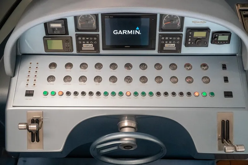 Slide: The Image of Control panel of a 1997 Magnum 56 yacht with Garmin navigation system. - 8