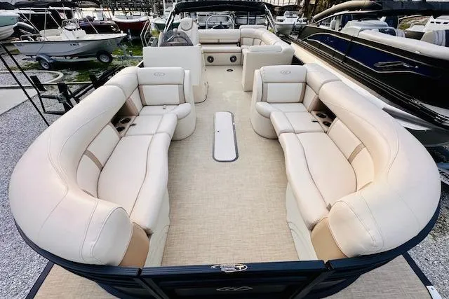 Slide: The Image of 2019 Harris Cruiser 250 pontoon boat with spacious seating and elegant design. - 8