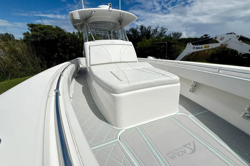 Slide: The Image of 2023 Contender 39 Fisharound boat with sleek white seating and modern design. - 12