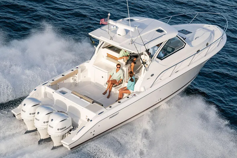 Slide: The Image of Manufacturer Provided Image: 2025 Pursuit OS 355 Offshore boat cruising on open water, featuring triple Yamaha engines. - 4