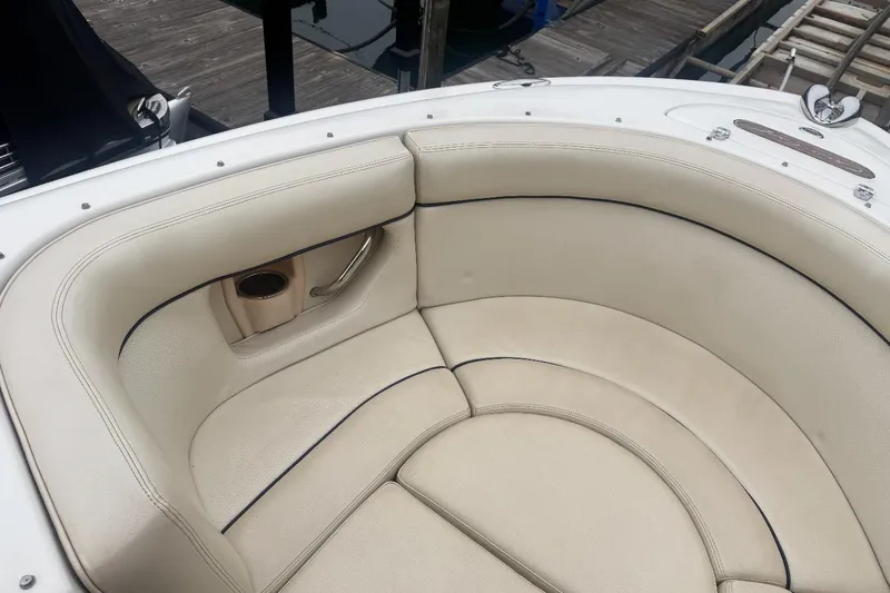 Slide: The Image of 2005 Chris-Craft Launch 22 boat interior with beige leather seating and cup holder. - 5