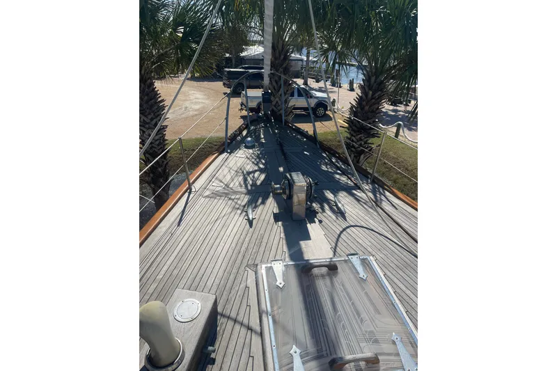 Slide: The Image of Deck view of 1972 Rhodes 53 Motorsailor, showcasing wooden finish and rigging details. - 18