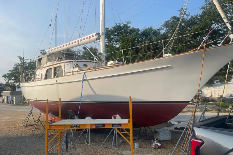 Slide: The Image of 1972 Rhodes 53 Motorsailor yacht on dry dock, undergoing maintenance. - 2