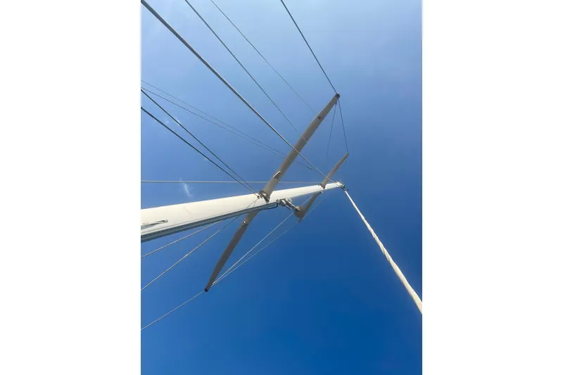 Slide: The Image of Mast and rigging of 1972 Rhodes 53 Motorsailor against clear blue sky. - 26