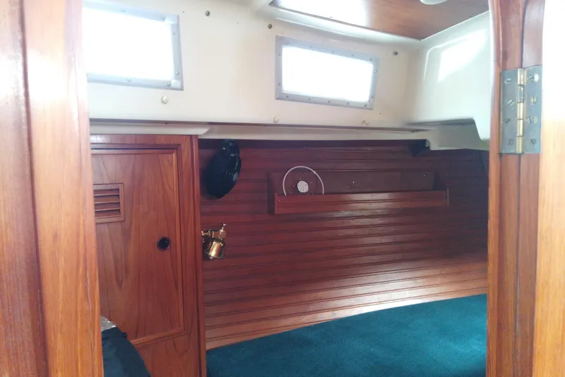 Slide: The Image of Interior of 1972 Rhodes 53 Motorsailor with wooden paneling and nautical decor. - 28