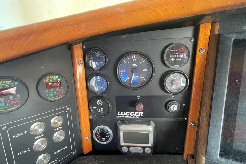 Slide: The Image of Control panel of a 1972 Rhodes 53 Motorsailor with gauges and switches. - 30
