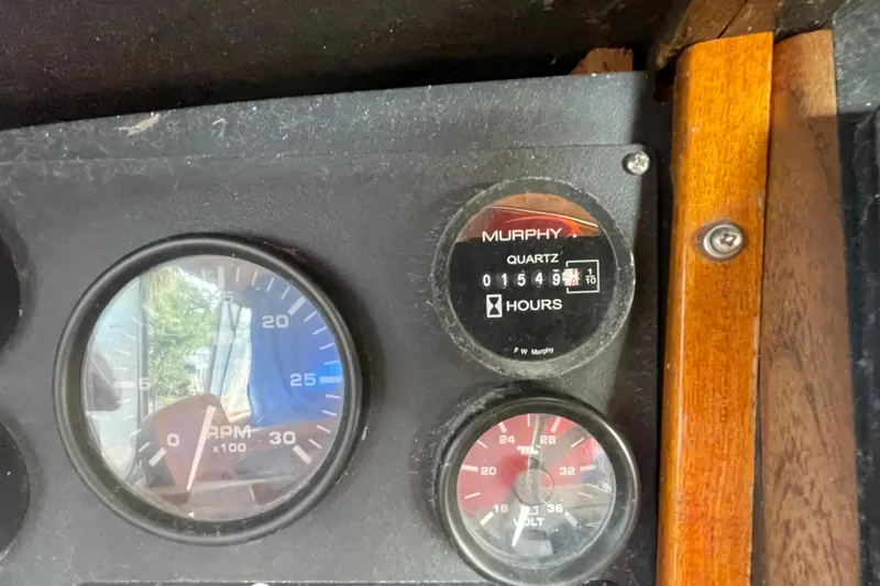 Slide: The Image of Dashboard of a 1972 Rhodes 53 Motorsailor with RPM and hour meters. - 31