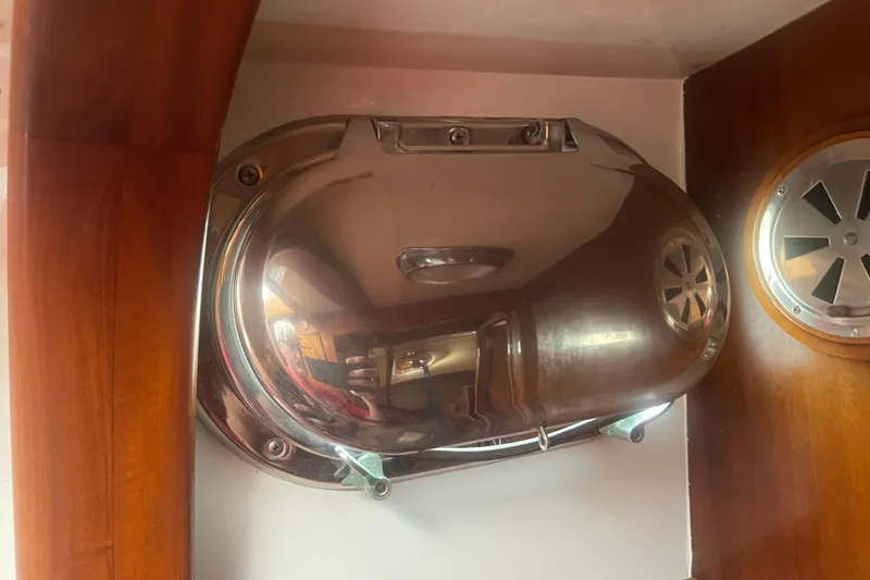 Slide: The Image of Shiny metal fixture inside 1972 Rhodes 53 Motorsailor, wooden paneling visible. - 37