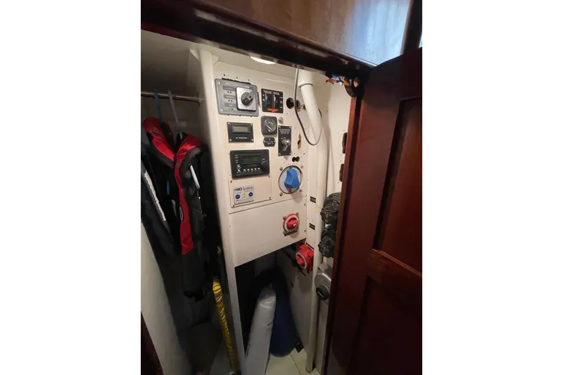 Slide: The Image of Control panel inside 1972 Rhodes 53 Motorsailor, featuring gauges and switches. - 40