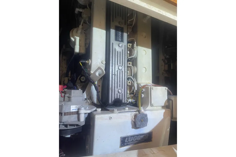 Slide: The Image of Engine compartment of a 1972 Rhodes 53 Motorsailor, featuring a Lugger engine. - 42