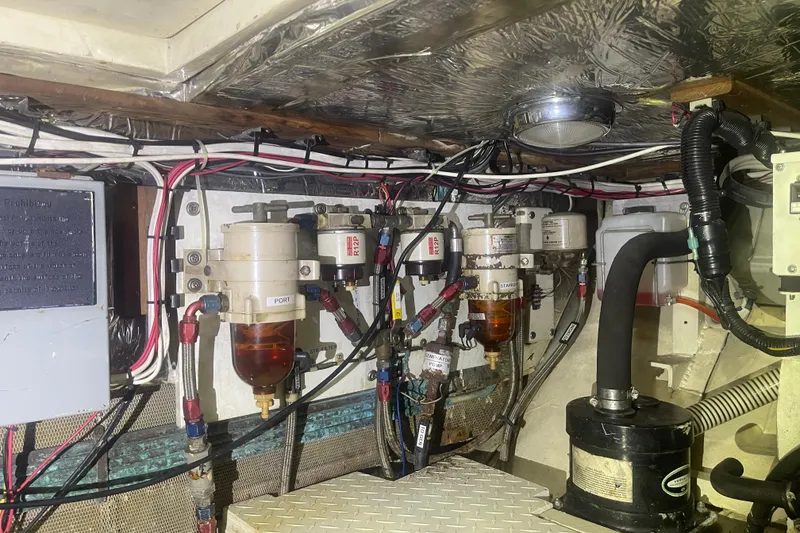 Slide: The Image of Engine room of 1972 Rhodes 53 Motorsailor with fuel filters and wiring. - 47