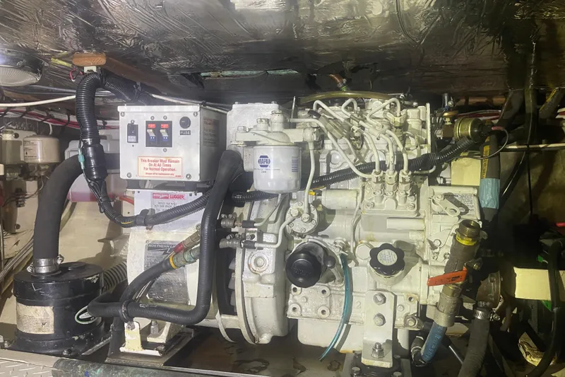 Slide: The Image of Engine room of a 1972 Rhodes 53 Motorsailor with visible mechanical components. - 48