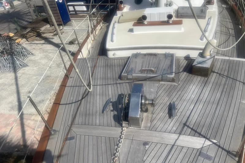 Slide: The Image of Deck of 1972 Rhodes 53 Motorsailor with winch and hatch, docked at marina. - 59