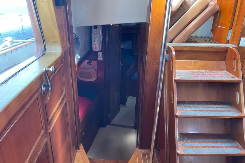 Slide: The Image of Interior of 1972 Rhodes 53 Motorsailor with wooden stairs and cabin view. - 62