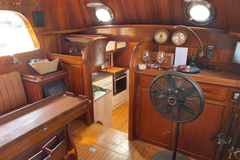 Slide: The Image of Interior of a 1972 Rhodes 53 Motorsailor with wooden finishes and nautical decor. - 65