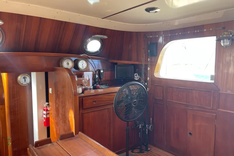 Slide: The Image of Interior of 1972 Rhodes 53 Motorsailor with wooden paneling and nautical instruments. - 71