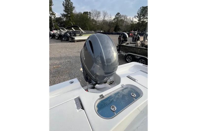 Slide: The Image of 2026 Tidewater 1910 Bay Max boat with Yamaha outboard motor in a marina setting. - 4