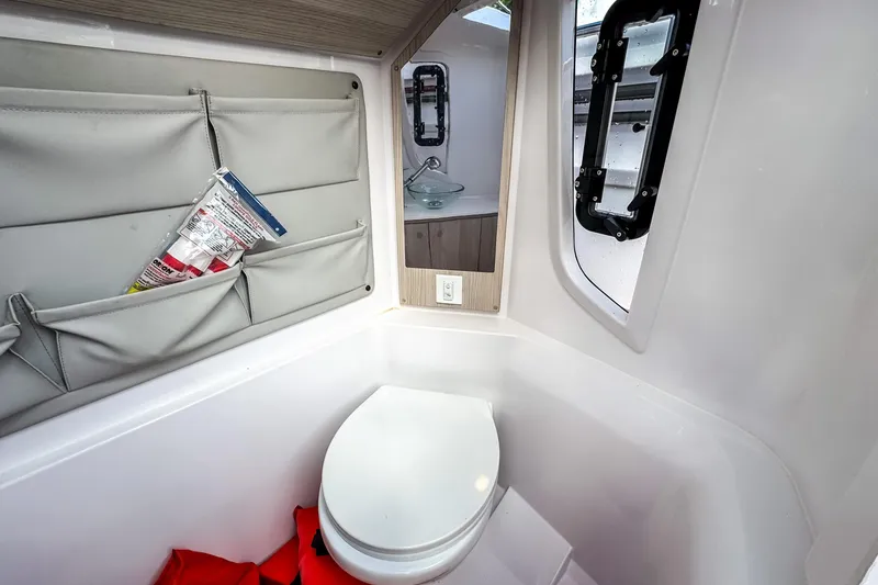 Slide: The Image of Interior of STERK 31 yacht with toilet and storage, model year 2025. - 19