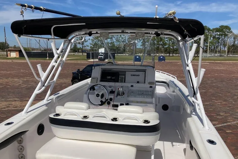 Slide: The Image of 2005 Donzi 35 ZF Daytona boat interior with steering console and seating. - 16