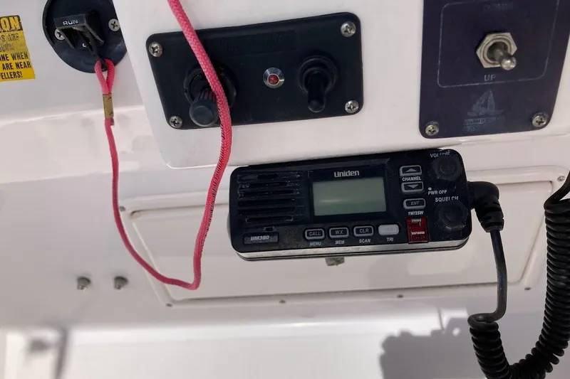 Slide: The Image of Control panel of a 2005 Donzi 35 ZF Daytona boat with Uniden radio. - 29
