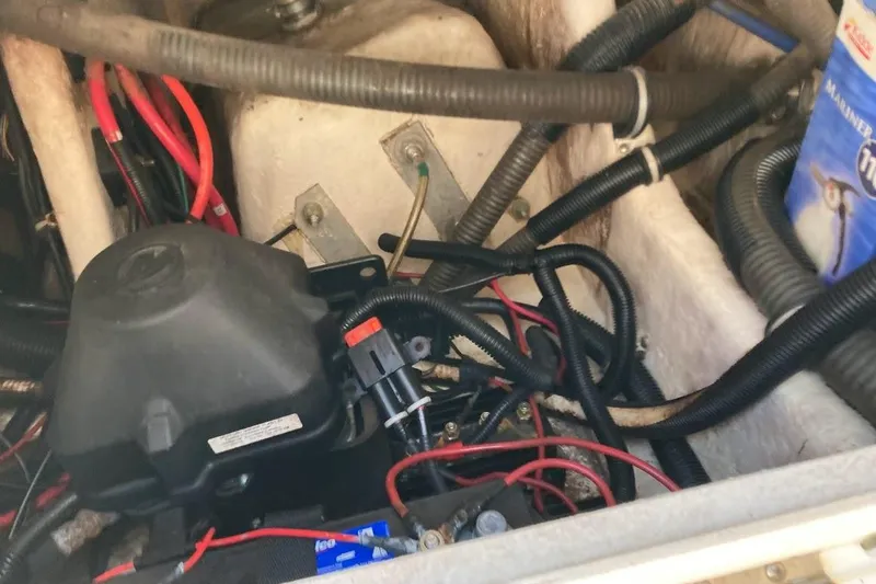 Slide: The Image of Engine compartment of a 2005 Donzi 35 ZF Daytona with visible wiring and components. - 38