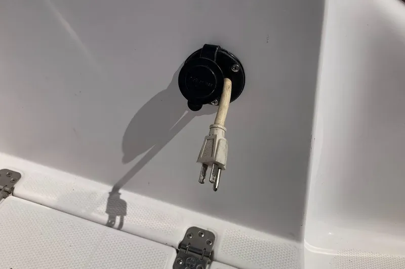 Slide: The Image of Power plug on 2005 Donzi 35 ZF Daytona boat, white surface background. - 48