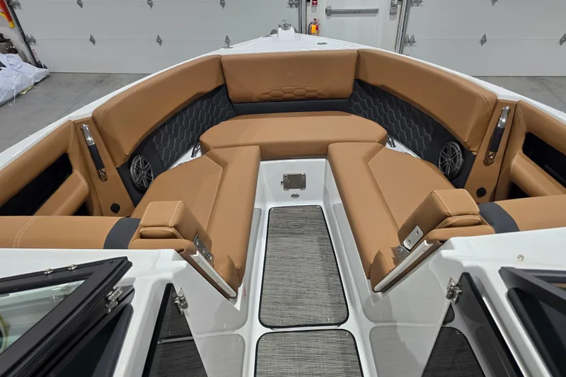 Slide: The Image of Interior of 2026 Four Winns H6 boat with tan seating and modern design. - 10