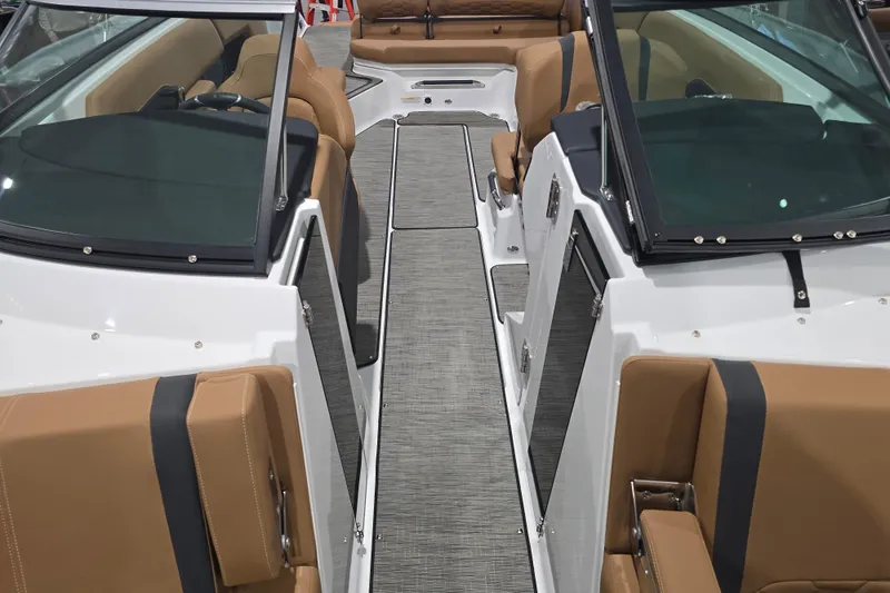 Slide: The Image of 2026 Four Winns H6 boat interior with tan seating and sleek design. - 13