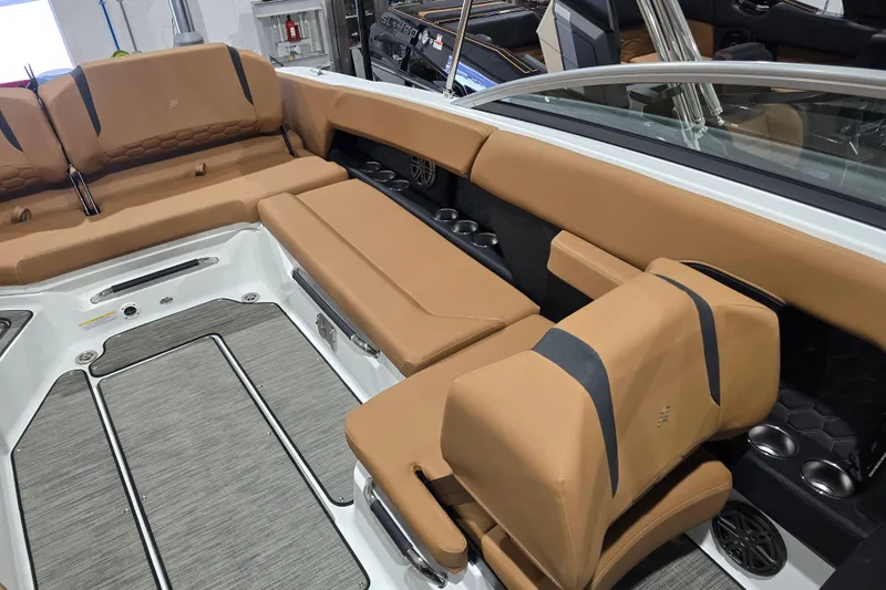 Slide: The Image of 2026 Four Winns H6 boat interior with tan leather seating and modern design. - 14