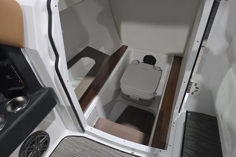 Slide: The Image of 2026 Four Winns H6 boat interior with compact toilet and modern design. - 16